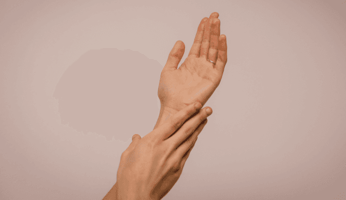 person caressing self alluding to affordable self-care plans