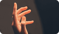A hand of someone experiencing somatic therapy