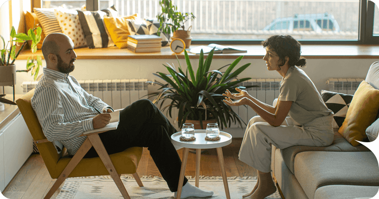 A psychiatrist starting a private practice speaks with a patient.