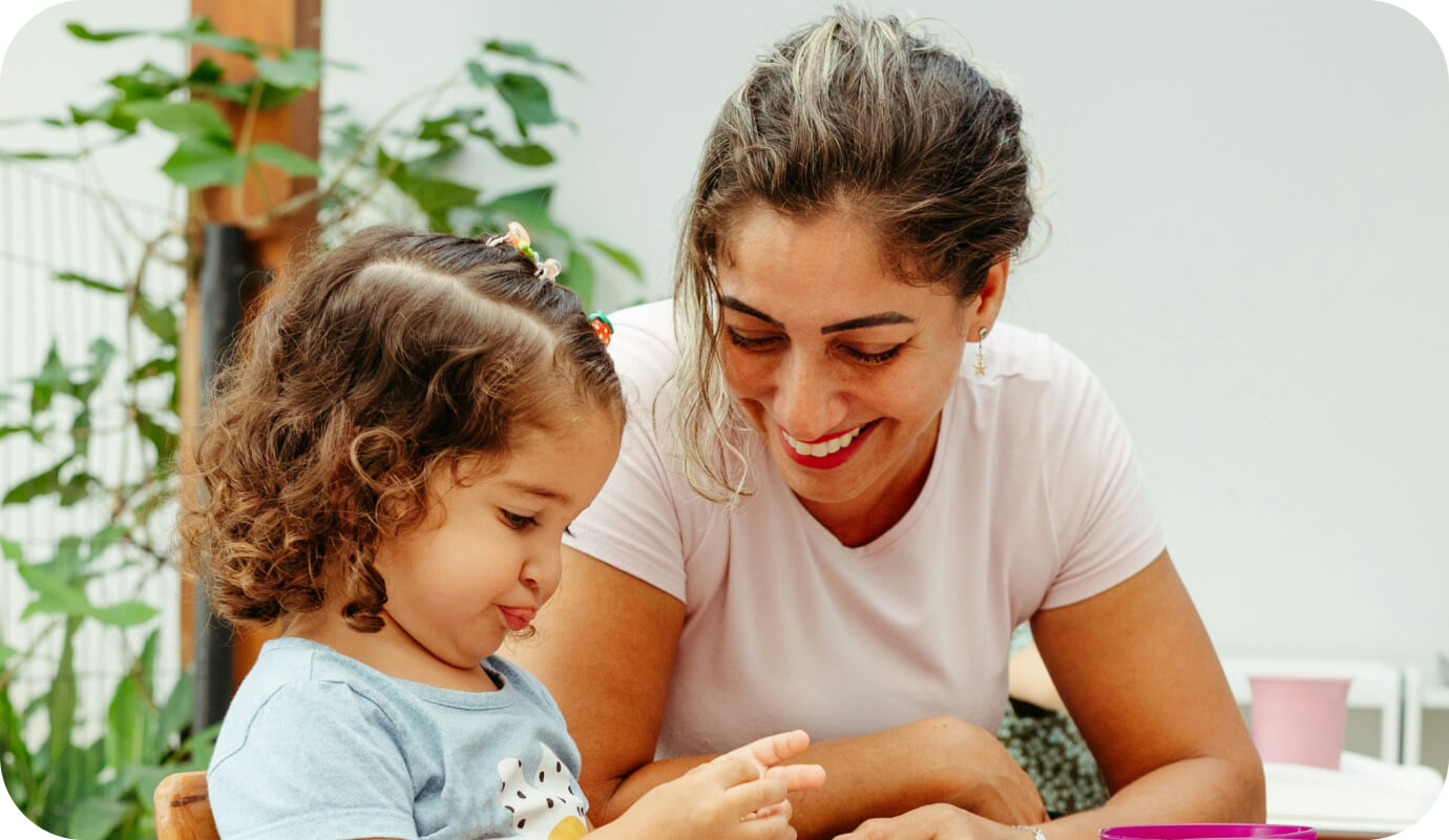 A female pediatric occupational therapy assistant works with a child and wonders how to become a pediatric occupational therapist