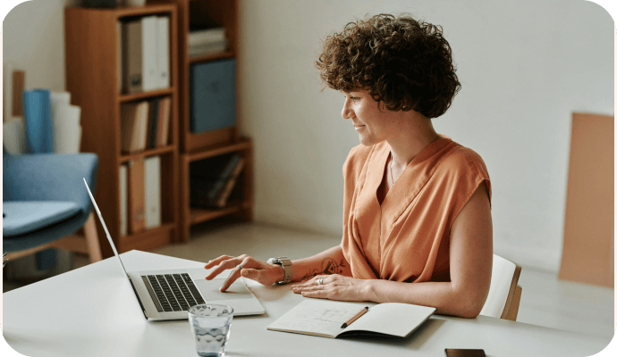 A female therapist looks at the top 10 therapist websites on her laptop computer