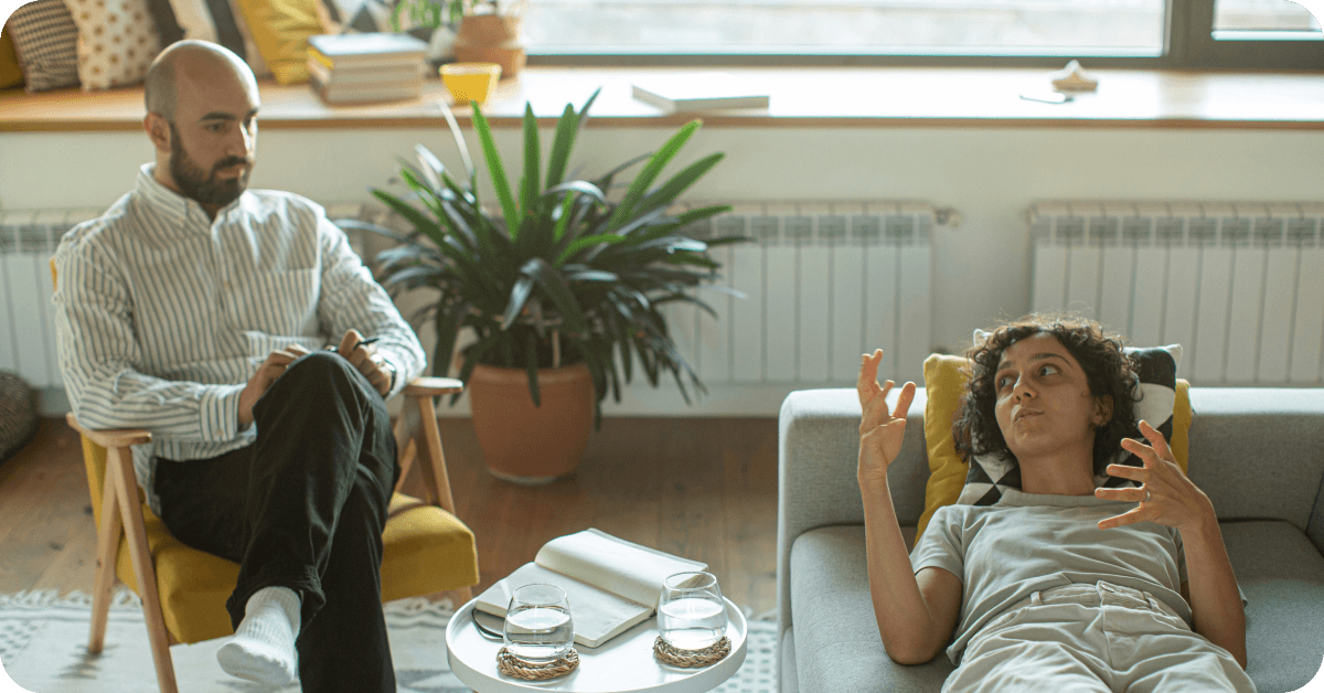 A client lays on their therapist's couch, gesticulating to illustrate an incident. The therapist uses a gestalt therapy exercise involving role-playing to help shift their client's perspective about an event. This article discusses gestalt therapy, an approach that helps clients with anxiety, depression, and relationship challenges.