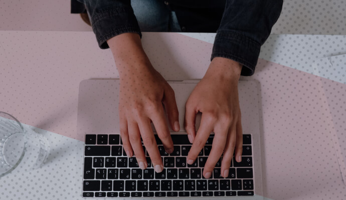 A person working at a laptop computer.