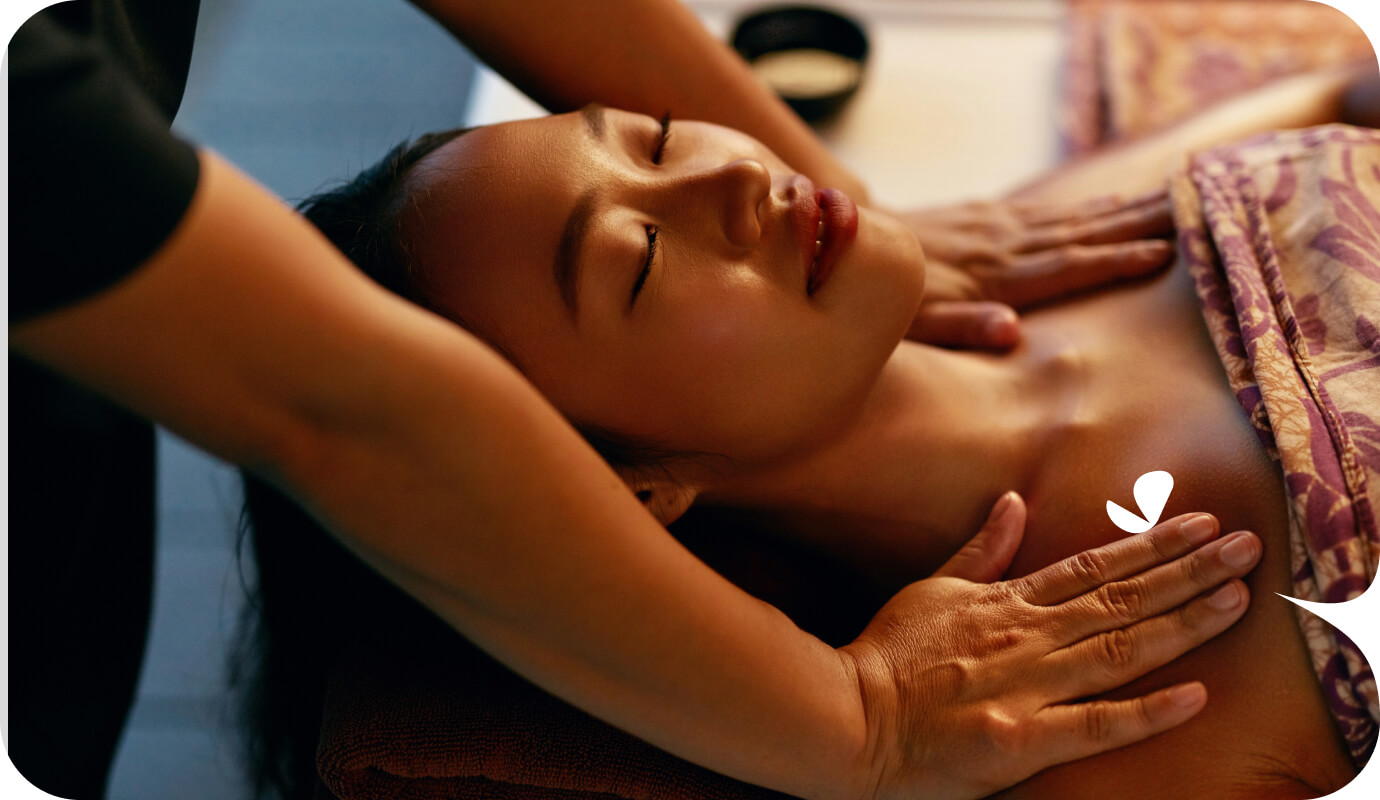 A massage therapist works on a client's shoulders. They will be using massage therapy SOAP notes to keep track of the treatments administered for their client.